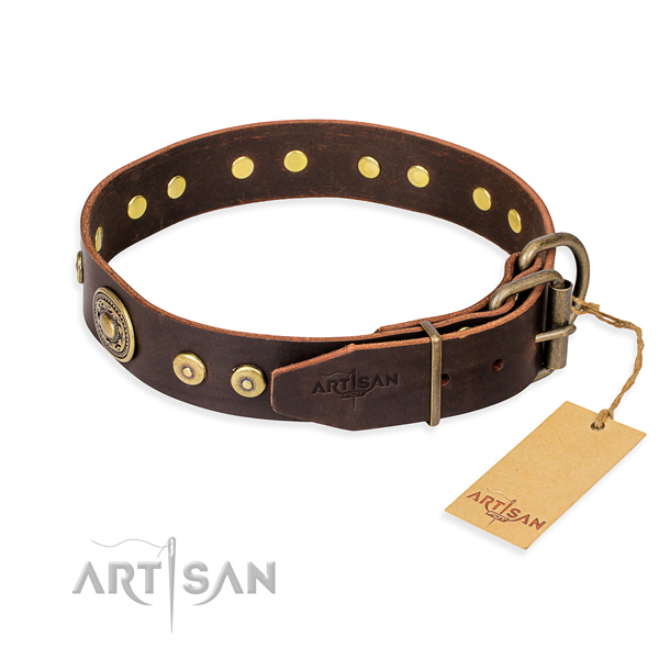 Natural genuine leather dog collar made of soft to touch material with corrosion resistant adornments